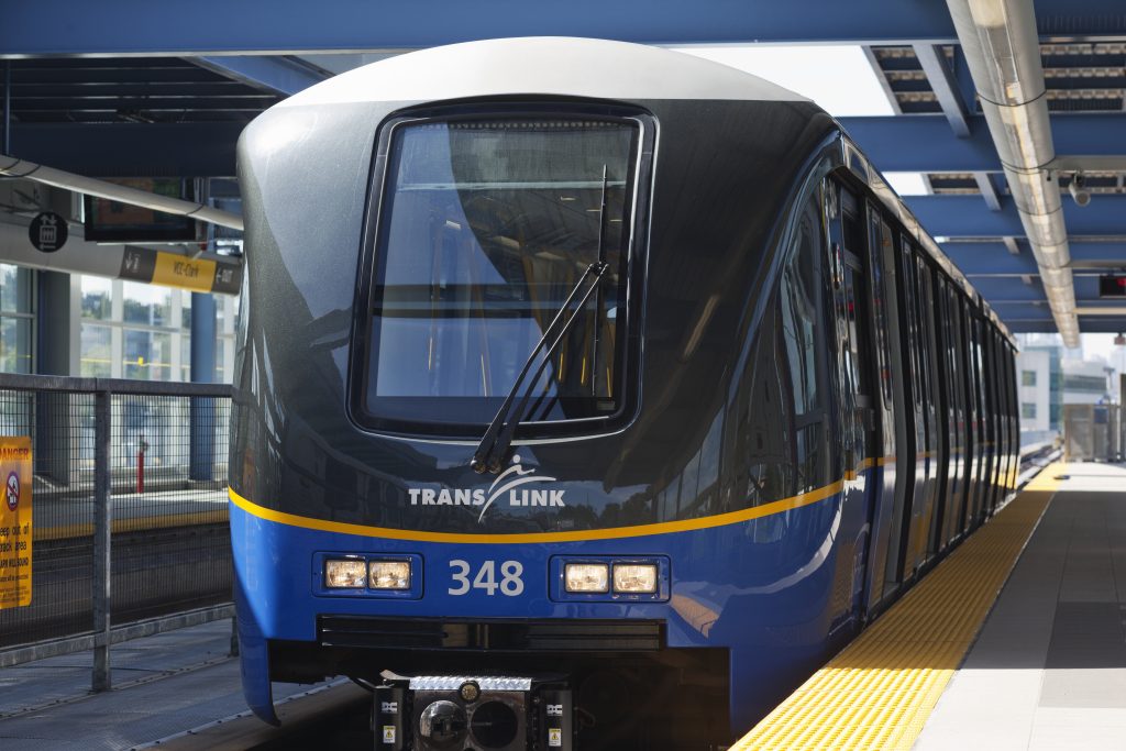 A TransLink SkyTrain car waiting on the platform level at a SkyTrain station. 